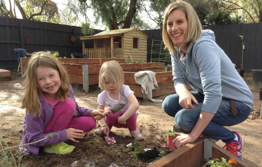 Teaching: Angie was determined to impart her love of gardening on Maggie and Sophie despite her motor neurone disease diagnosis. Pictures: Supplied.