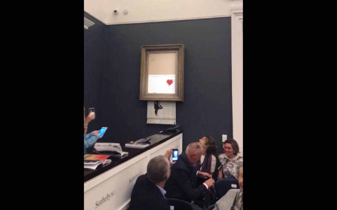 Just after the hammer came down, the bottom half of the work Girl with Ballon passed through a shredder concealed in the frame. Sotheby's said the painting was being sold with a new title, Love is in the Bin. 