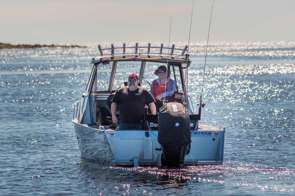Kelly 'Hooch' Hunt and Clinton Howe aboard their fishing boat on the Leven River, Ulverstone. Picture: Phillip Biggs 