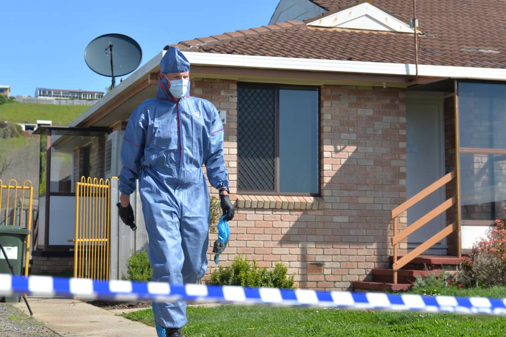 Forensic investigators at the Colac Court home. 
