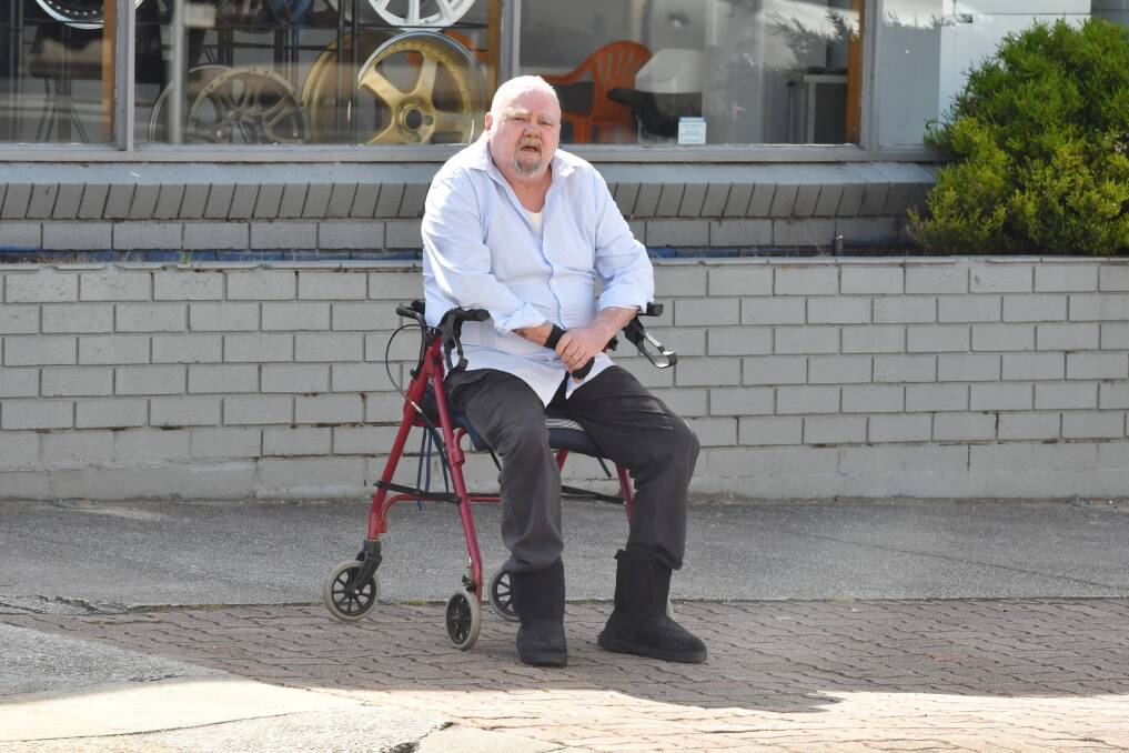 GUILTY: John William Milligan, pictured using his walker outside the Supreme Court during his trial this week, was found guilty by a jury of two firearms offences for the incident at his Somerset home in 2018. Picture: Brodie Weeding 