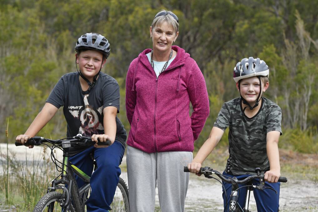 Ben, 11, and Cooper, 9, Wyllie with Grandma Tracey Wyllie at the Dial Range mountain bike trails. 