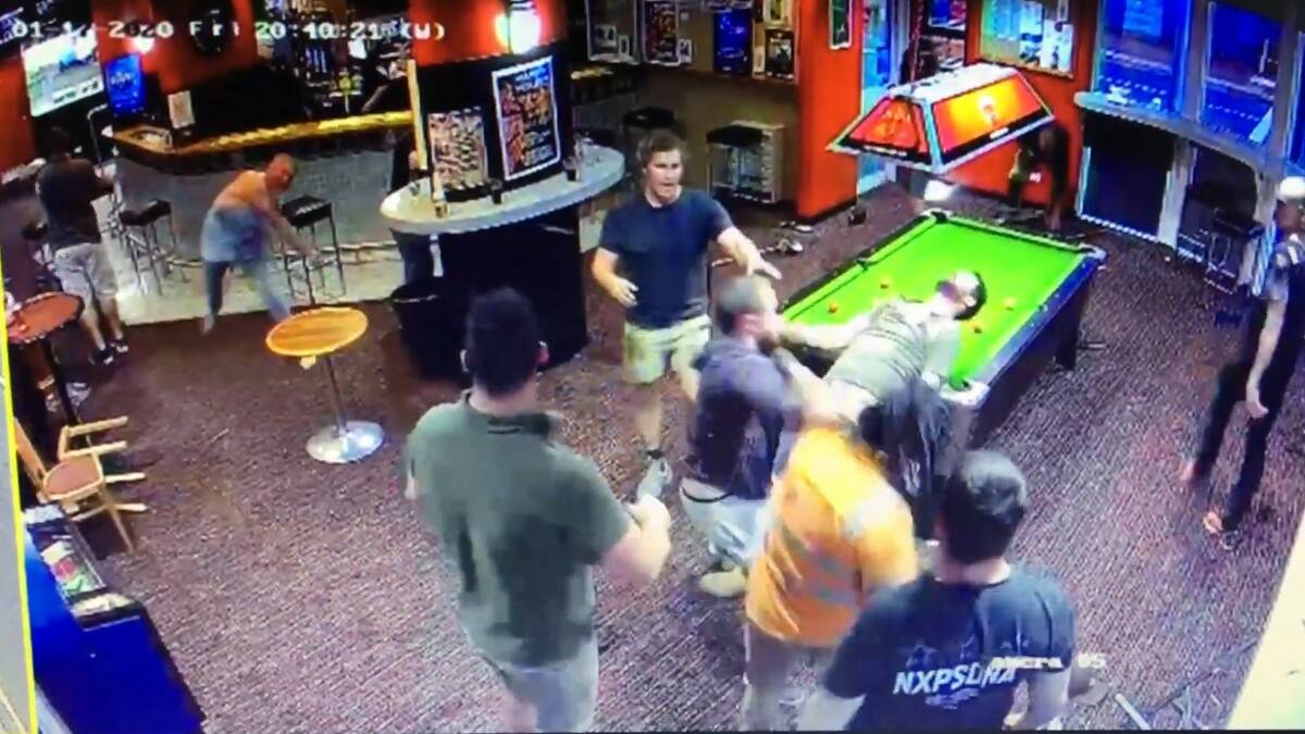 A screengrab from the footage of the brawl appears to show a man being knocked out across the pool table. 