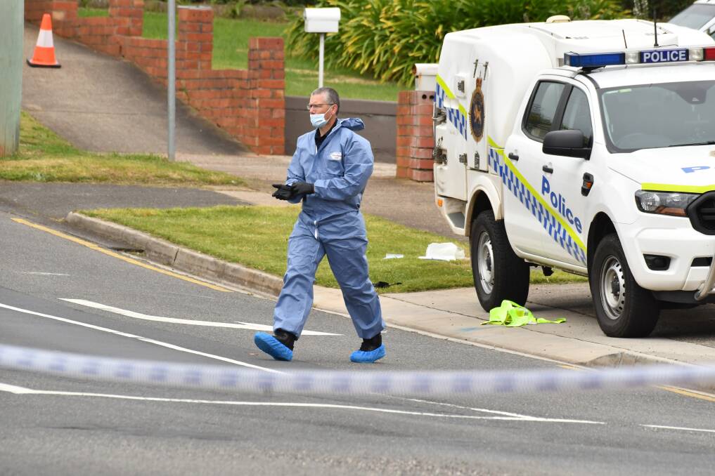 A forensic investigator on the scene of the Devonport murder suicide. Picture: Brodie Weeding