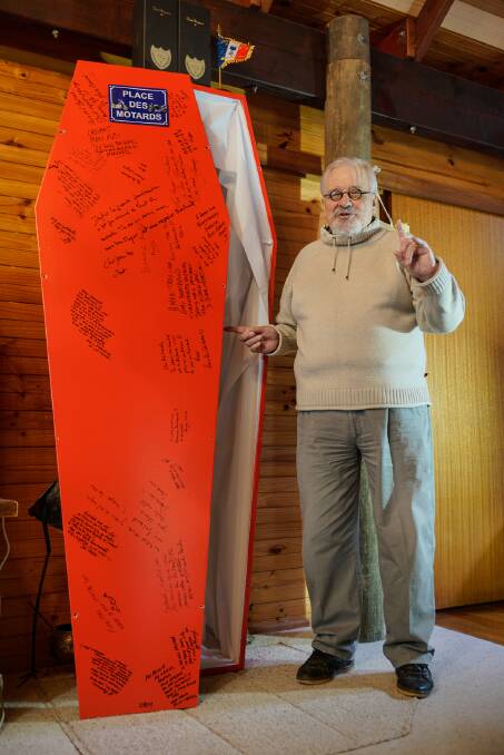 Bertrand Cadart with his Ducati/Ferrari red painted cardboard coffin signed by those who attended his living wake.