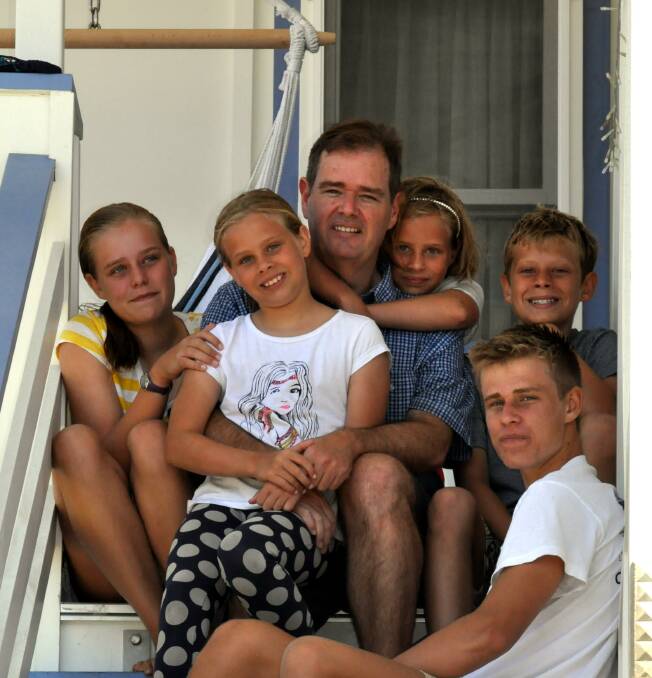 Teen Brain author David Gillespie with his five children, who can only use devices which are attached to the wall in an open place within the family home. 