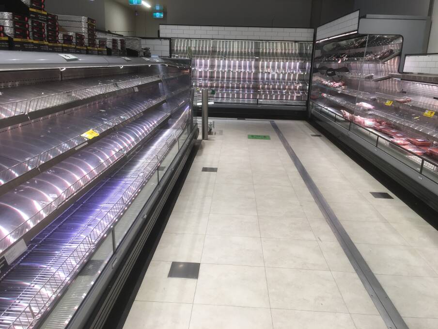 Empty: Photos in a Tasmanian supermarket show close-to-empty meat fridges.
