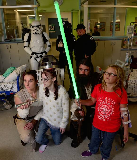 MAY 4: Shannon Cassidy and Grace Orchard met Jakku scavenger Rey (Bec Rossiter) and Jedi Dan Chugg, with Imperial stormtrooper Lee Moore, Death Star gunner Sam Carriere and Imperial crew Ezra de Vos. Picture: Phil Biggs