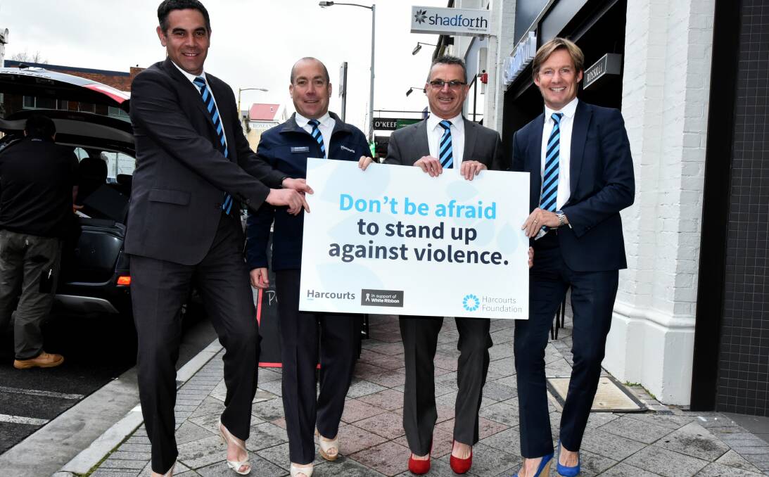 WALKING TALL: Harcourts' Jeremy Wilkinson, Andrew Claxton, James Bird and Tony Morrison prepare for Walk a Mile in Her Shoes. Picture: Neil Richardson.
