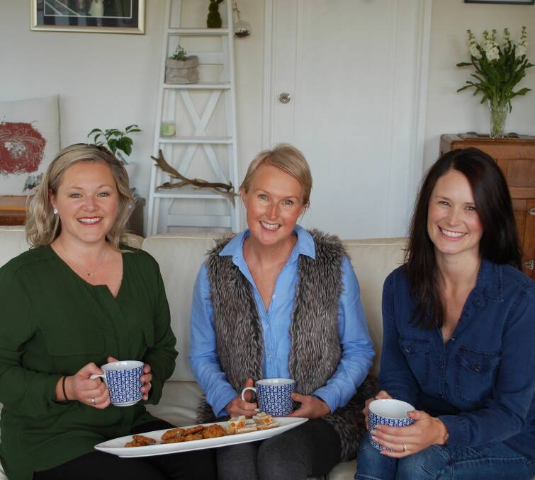 GETTING TOGETHER: Rachel Williams, Trudi Johnston and Natasha Green have a cuppa ahead of Cancer Council Tasmania fundraiser Girls' Night In. Picture: Emily Baker.