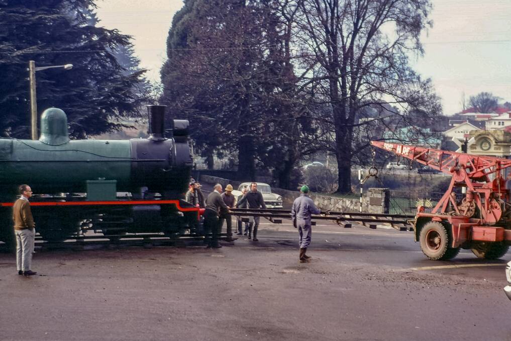Moving Deloraine's steam train across Emu Bay Road to the train park. Picture: Supplied/Allan Enright