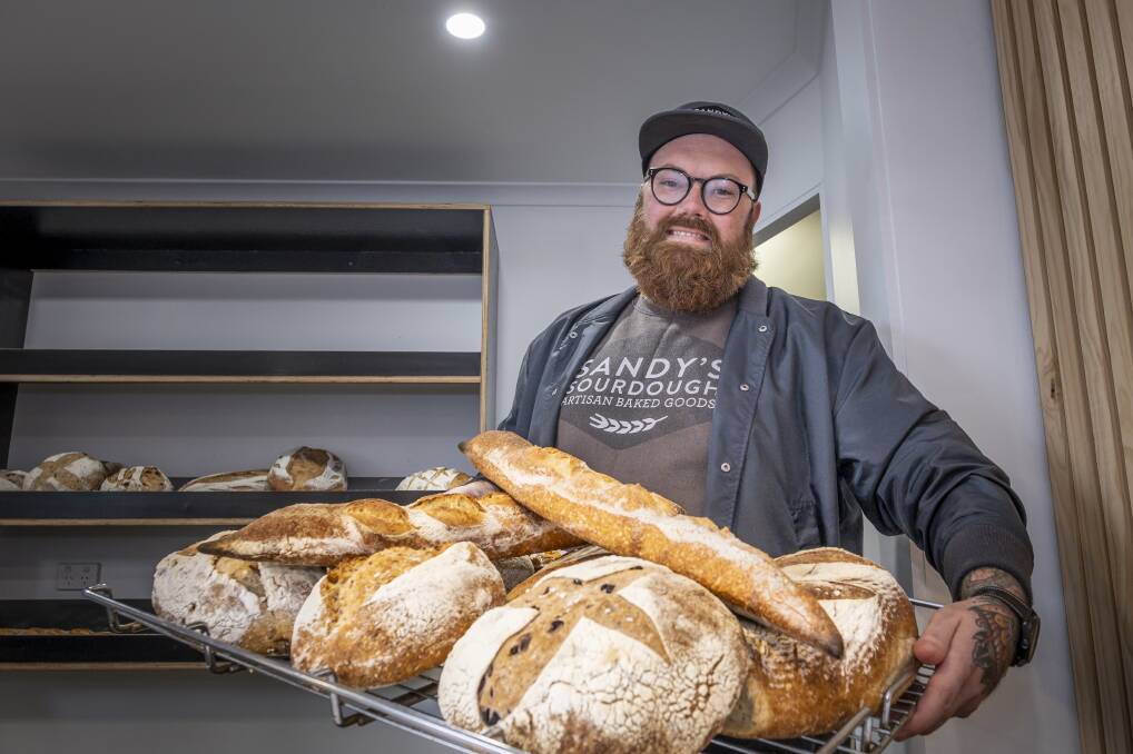 TASTY TREATS: Josh Crisp of Sandy's Sourdough with a selection of the boutique bakery's offerings. Picture: Craig George