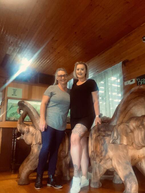 Closing time: Louise Williams and daughter Georgie on the famous elephant seat. Picture: Supplied/Georgie Williams