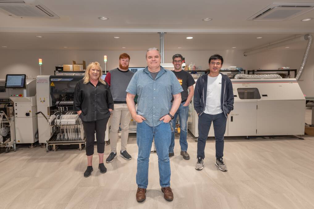 DREAM TEAM: Louise Flynn, Brendan Hodkinson, Mike Cruse, David Cook and Jingchen Fan at the Definium Technologies office. Picture: Craig George