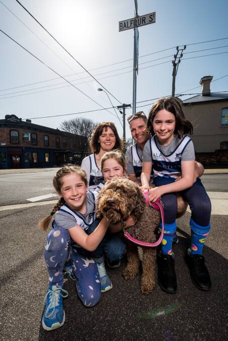 Ready to feel the burn: Fiona and Jonty Barnett. daughters Annie, Lucy and Emma, and dog Piccolo. Picture: Phillip Biggs