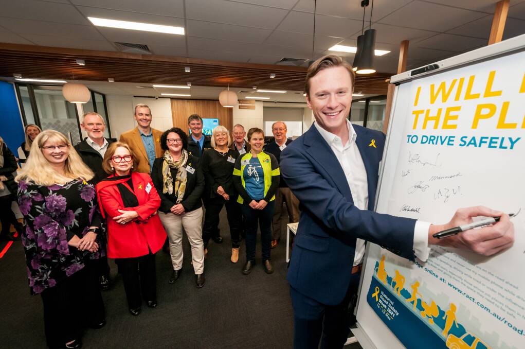 PROMISE: RACT chief executive Mark Mugnaioni signs a road safety pledge at the launch of National Road Safety Week. Picture: Phillip Biggs