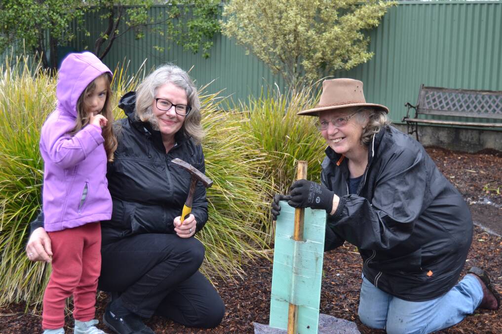 Planting day: 4-year-old Ella Kelty of Exeter with Cathie Burr and Jayne Shaper. Picture: Ebony Abblitt