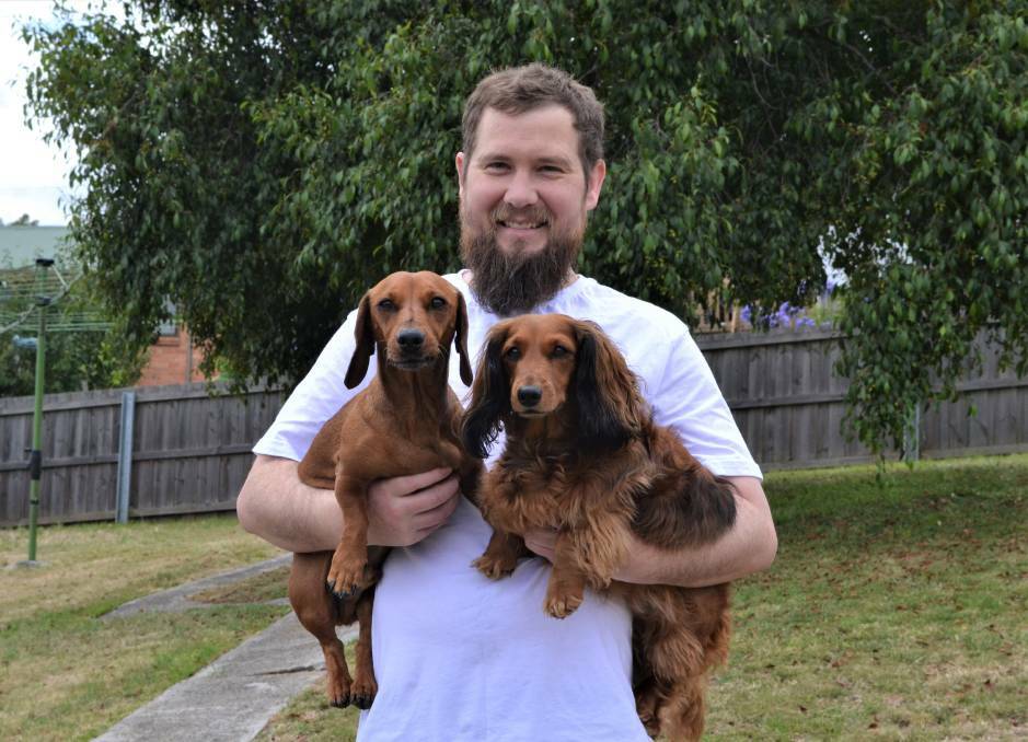 Daniel Hartley with dogs Murph and Milly prior to the shave. Picture: Adam Holmes