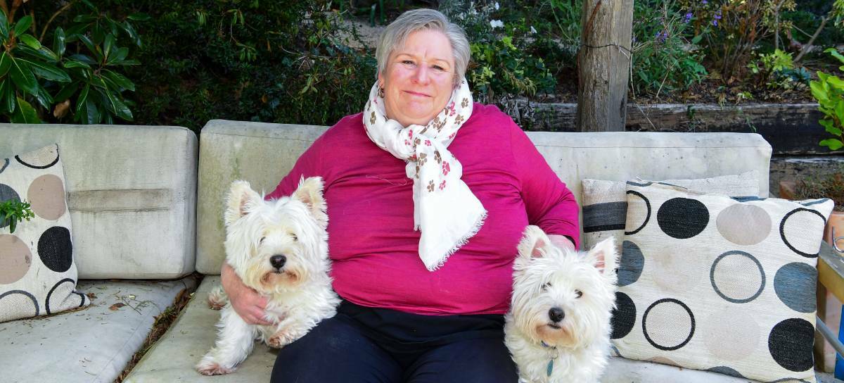  Discount day: Jan Davis and two of her dogs Kiwi and Loki. Picture: Neil Richardson