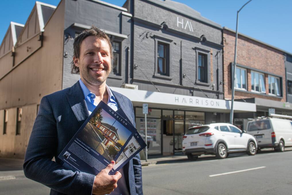NEW LOOK: Harrison Agents director Tom Harrison outside the newly branded office on Brisbane Street. Picture: Paul Scambler