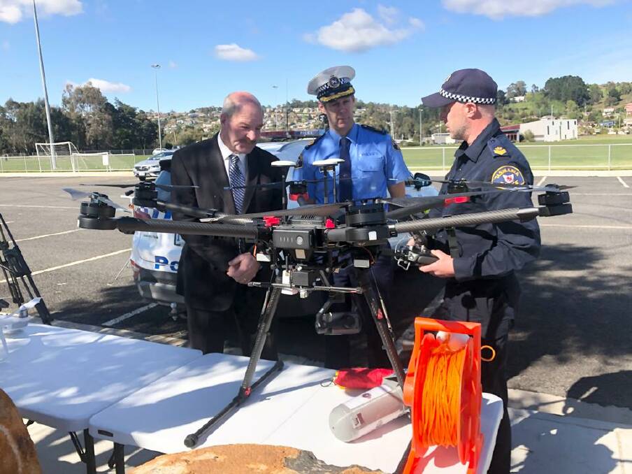 Ready for takeoff: Police Minister Mark Shelton, acting Assistant Commissioner Robert Blackwood and Senior Sergeant Mark Forteath. Picture: Supplied
