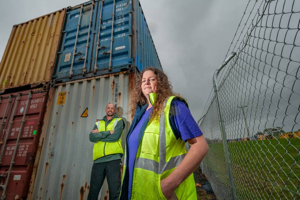 CONVERSION PLAN: Strike It Out founder Kirsten Ritchie and volunteer Andrew Cassidy with the shipping containers to be fitted out. Picture: Phillip Biggs