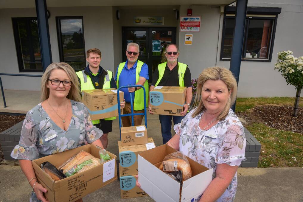 Handy hampers: Debbie Rigby and Robyn Ponting from Kings Meadows High School Launceston Benevolent Society's Jay Spinks, Rod Spinks and Don Leggett. 