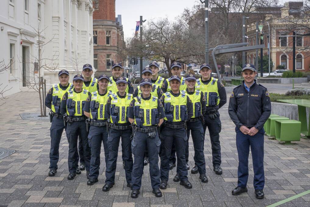 FIRST DAY: Launceston Inspector Nathan Johnston (right) with the 13 new constables serving the area. Picture: Craig George