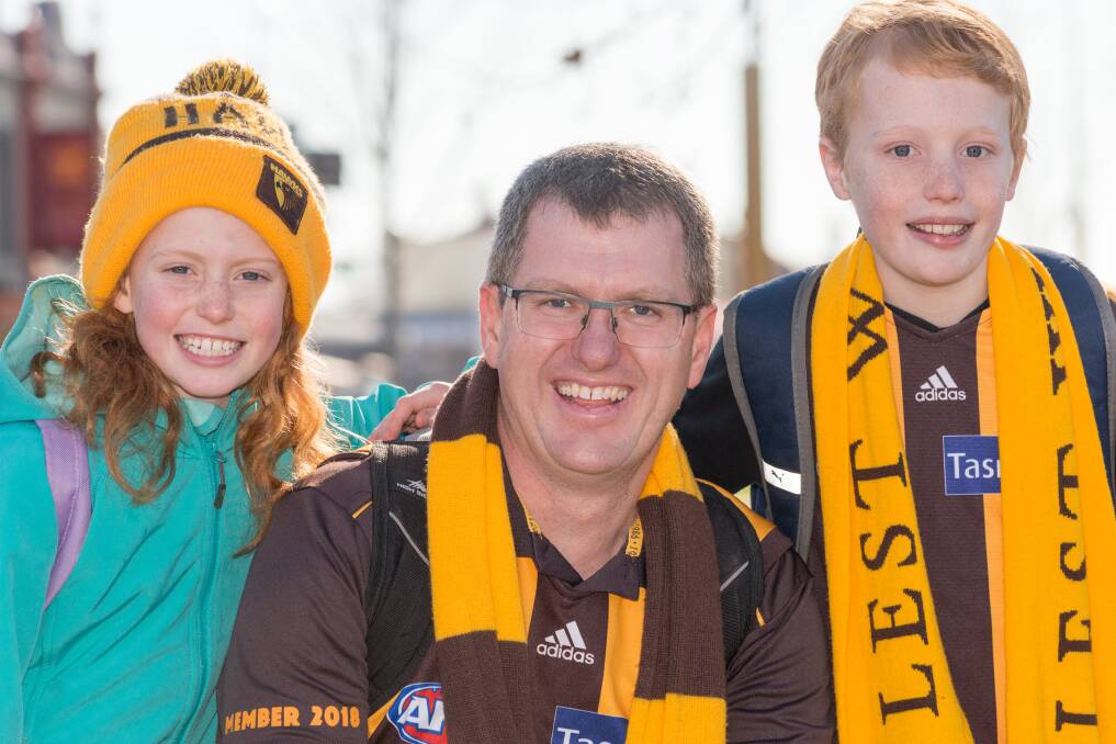 HAWKS FANS: Georgia, Mark and Max Chettle of Wynyard travelled to Launceston to watch their beloved Hawthorn play Fremantle at UTAS Stadium. Picture: Phillip Biggs