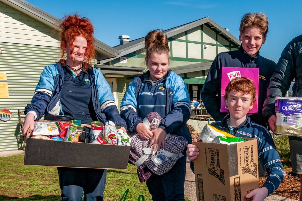 Deloraine High students Charlotte Gray, Kyesha McGowan, Jake Edwards and Ryan Wilson with donated goods.