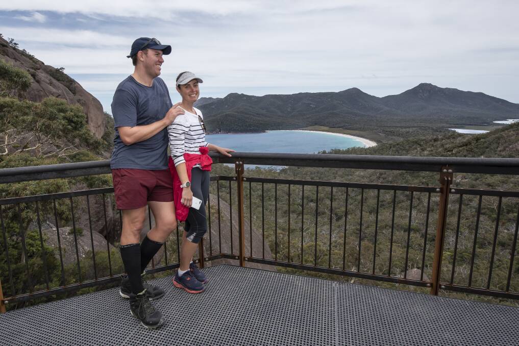 PICTURESQUE SCENERY: Brisbane couple Murray Hodges and Sally Farquhar enjoy the new view from the Wineglass Bay lookout. Pictures: Craig George