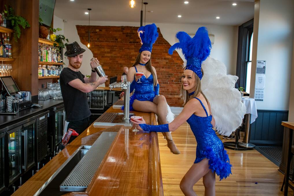 SHOW TIME: Sports Garden Hotel bartender Jack May with performers Porschea George and Amy Stringer. Picture: Paul Scambler.