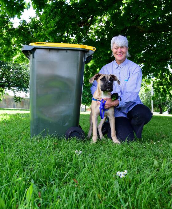 Beyond the bin: Andrea Dawkins and Pickle the dog are urging Tasmanians to support the initiative. Picture: Neil Richardson