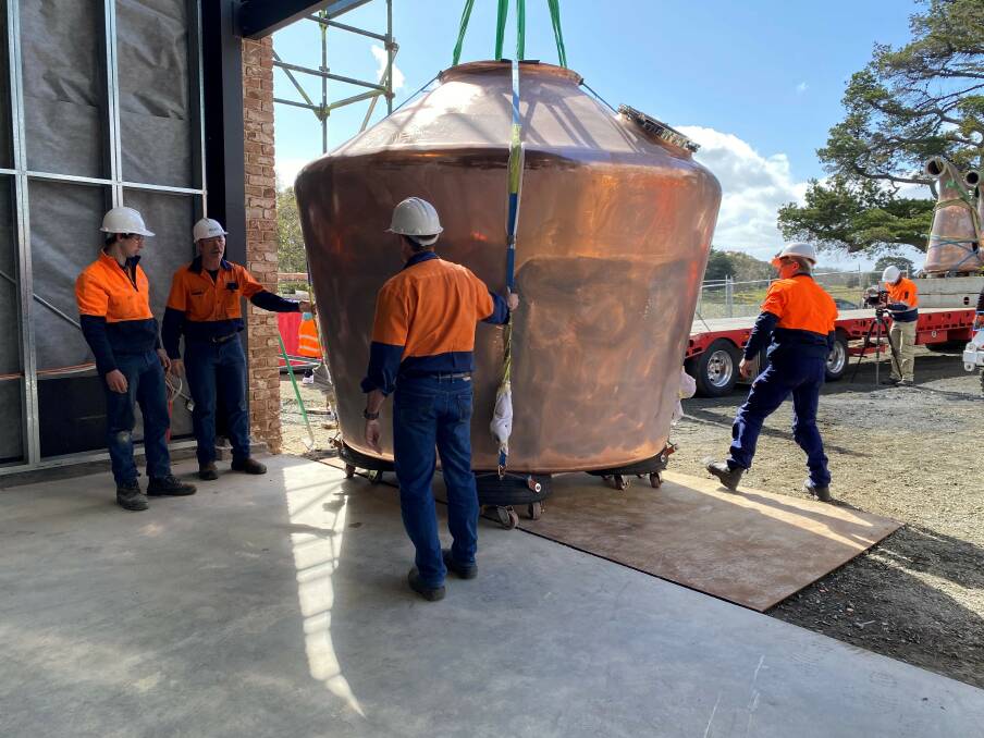 Moving in: Workers from Stillsmiths installing a large copper pot still at Callington Mill Distillery. Picture: Supplied