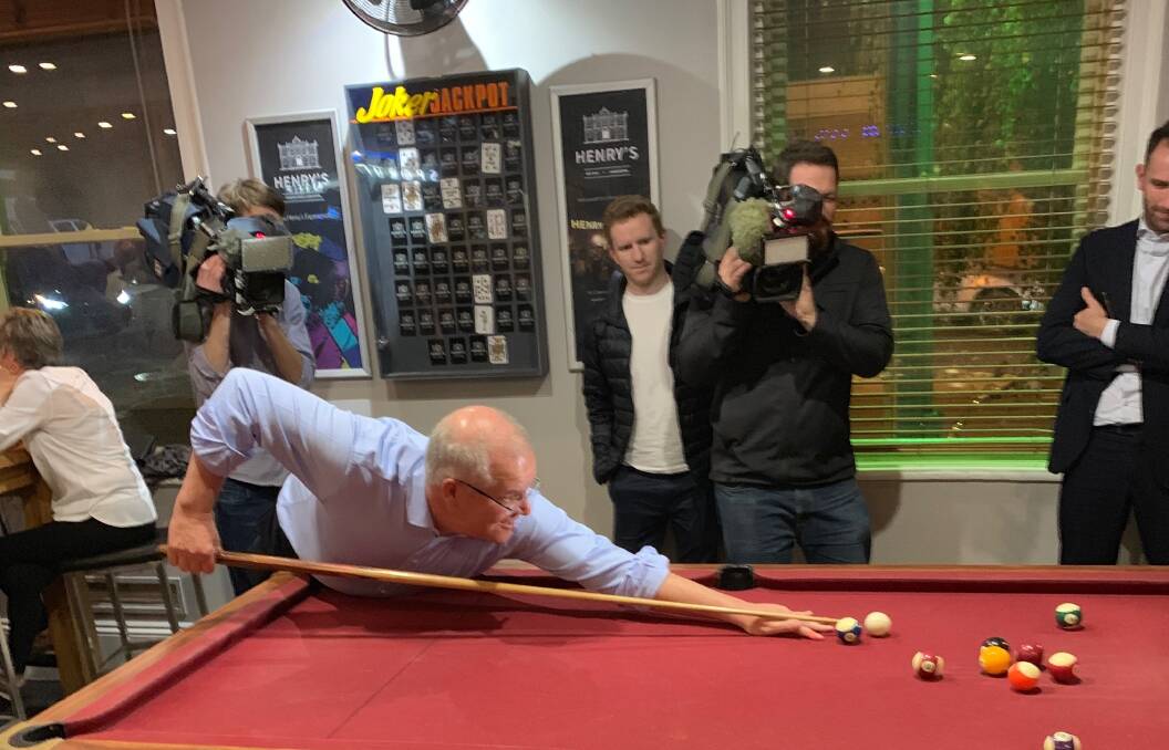 PUB TEST: Prime Minister Scott Morrison joins a pool tournament at Launceston pub Sporties on Tuesday night. He was reportedly 'towelled up'. Picture: Supplied