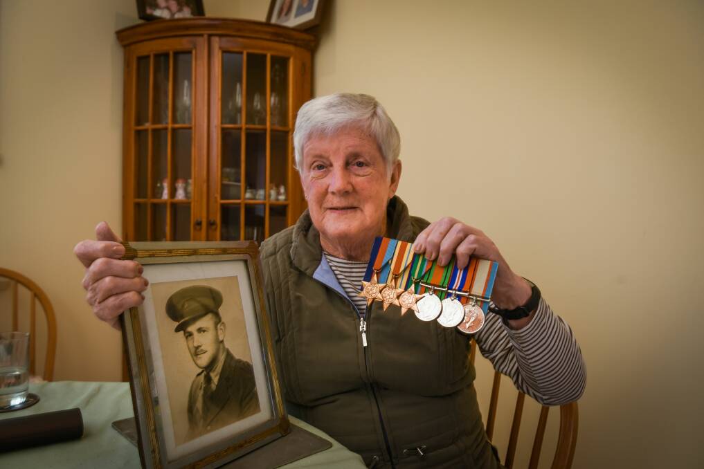 HISTORY PRESERVED: Diane Fowler, of Trevallyn, with a photo of her late uncle Lieutenant Keith Raymond Brown, as well as his war medals. Picture: Paul Scambler