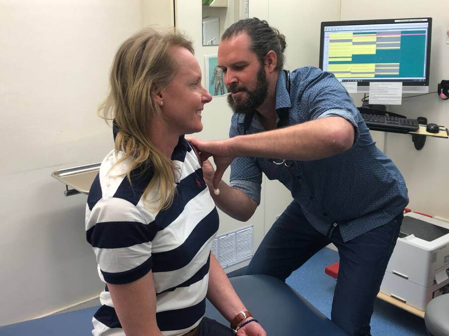 Health Minister Sarah Courtney receives her measles vaccination from Dr Toby Gardner at Newstead Medical.