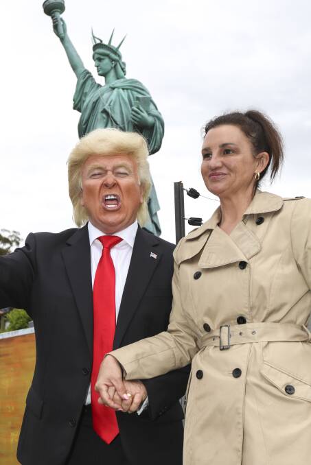 Senator Jacqui Lambie poses with a Donald Trump impersonator at Tasmazia in 2017.