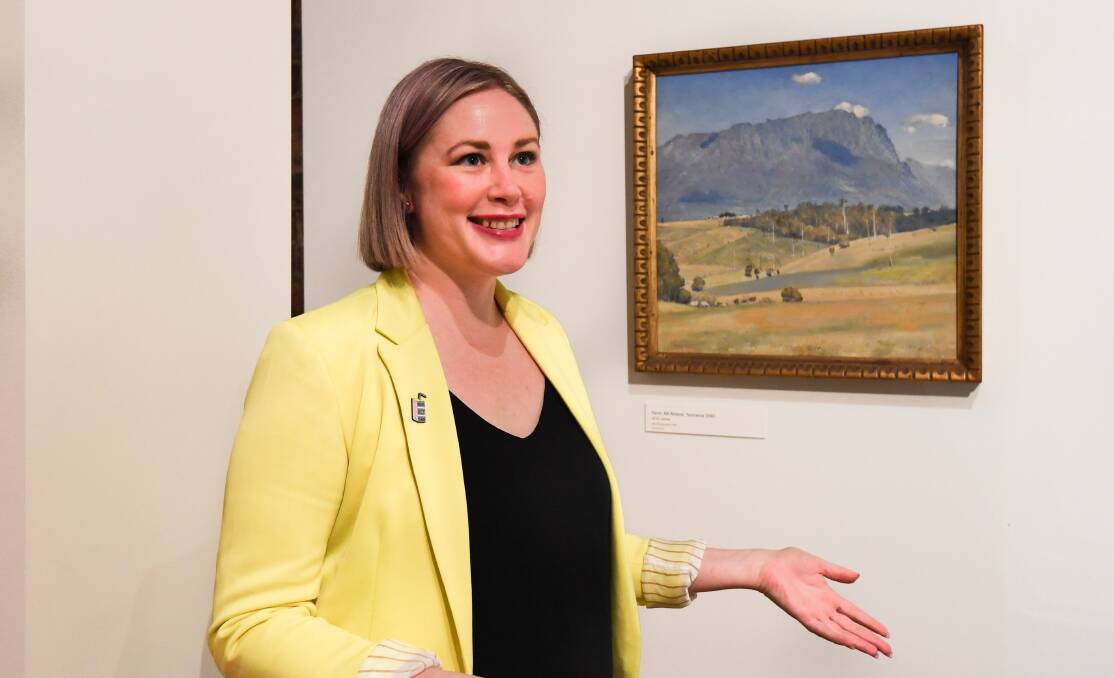 UNVEILED: QVMAG visual arts and design senior curator Ashleigh Whatling with a work by Tom Roberts. Picture: Neil Richardson