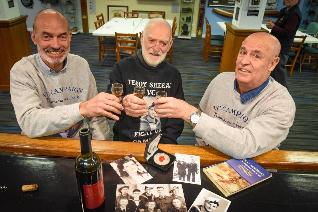 A TOAST: Veterans' Affairs Minister Guy Barnett, veteran Jack Bird and Garry Ivory, the nephew of Edward 'Teddy' Sheean. Picture: Paul Scambler