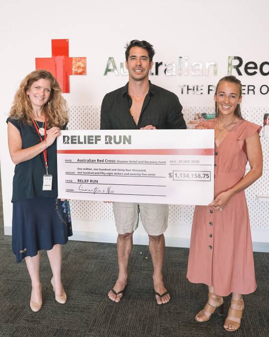 Nic Davidson (centre) and Samantha Gash (right) present a $1 million cheque to the Australian Red Cross.