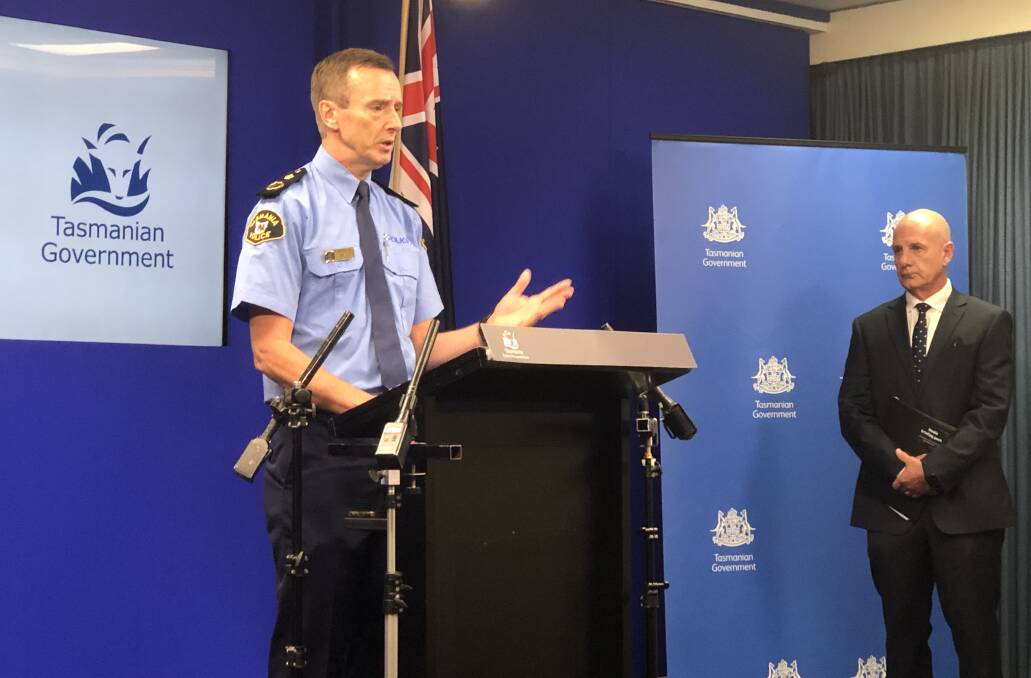 Police Commissioner Darren Hine addresses the media alongside Premier Peter Gutwein.
