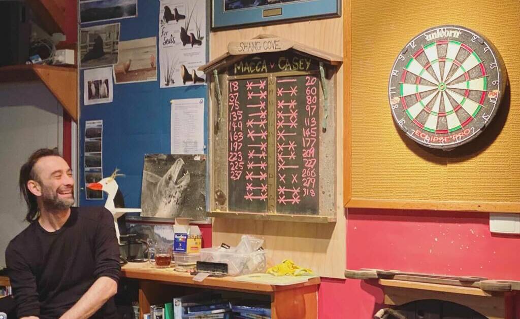 HITTING THE MARK: Jason Davey, a meteorological observer at Macquarie Island Station, is a participant in a darts tournament in which all four Antarctic stations are competing for bragging rights. Picture: Supplied