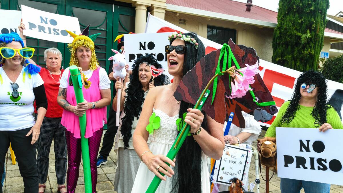 Anne-Marie Loader (centre) playing the role of Lady Godiva outside the Town Hall at Westbury, flanked by fellow opponents of the Northern Regional Prison. Picture: Neil Richardson