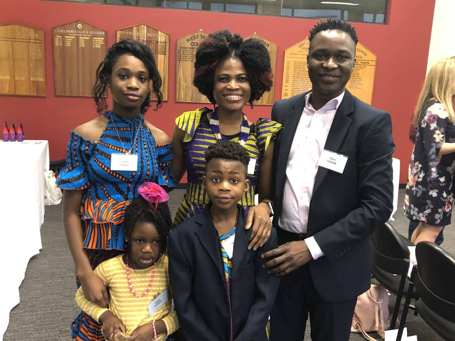 PROUD: The Fanam family after being conferred Australian citizenship. Clockwise from left: Nutifafa, Rebecca, Peter, Eyiram and Kafui. Picture: Rob Inglis