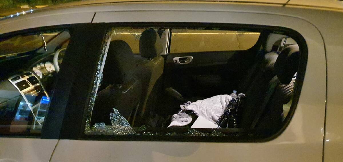 Dangerous: The car window that was smashed after a rock was allegedly thrown at traffic by youths at East Devonport. Picture: Facebook. 