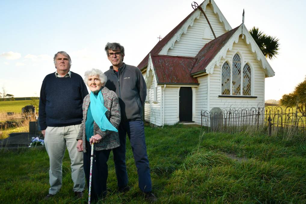 Parishioners: Brian and Patricia Stewart and Richard Thomas at St George's Anglican Church at Moriarty which is listed to sell. Picture: Brodie Weeding.