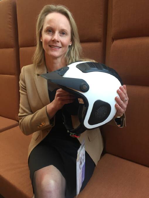 HELMET: Minister Sarah Courtney showed MLCs a helmet specially designed for quad bikes. Picture: Sue Bailey.