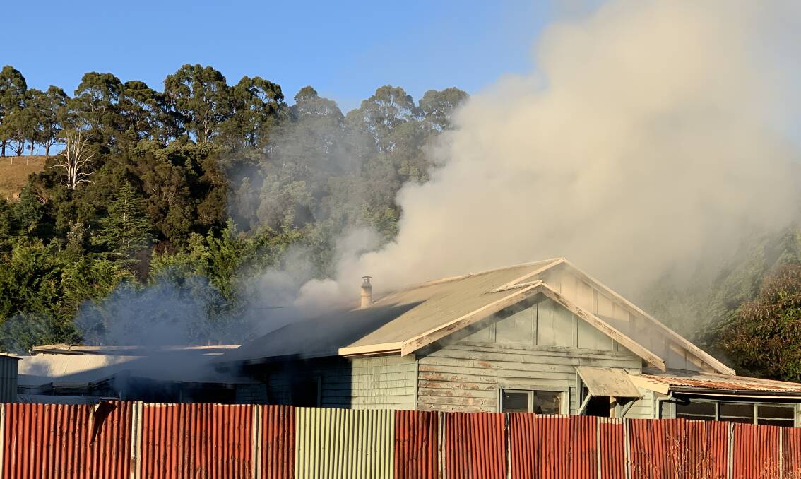 Fire: Smoke pours from a South Burnie home early on Wednesday.