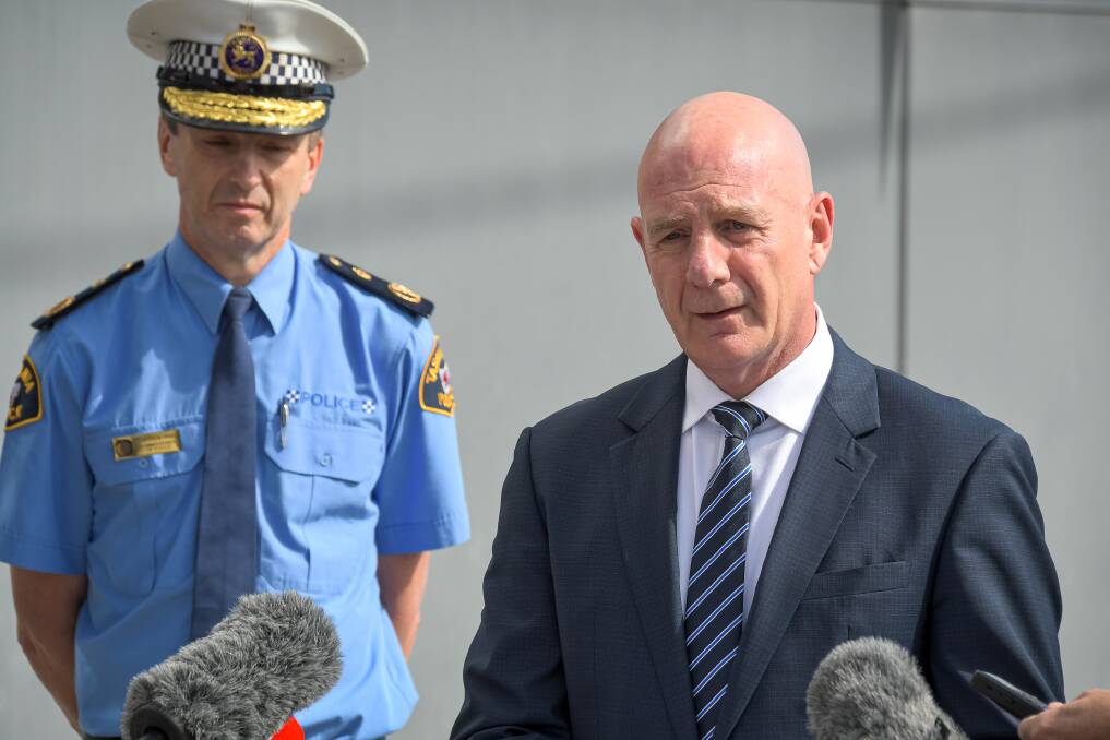 Update: Premier Peter Gutwein speaks to the media as Police Commissioner Darren Hine looks on. Picture: Simon Sturzaker.